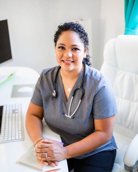 Yvette, a registered nurse turned medical device sales representative, at her desk